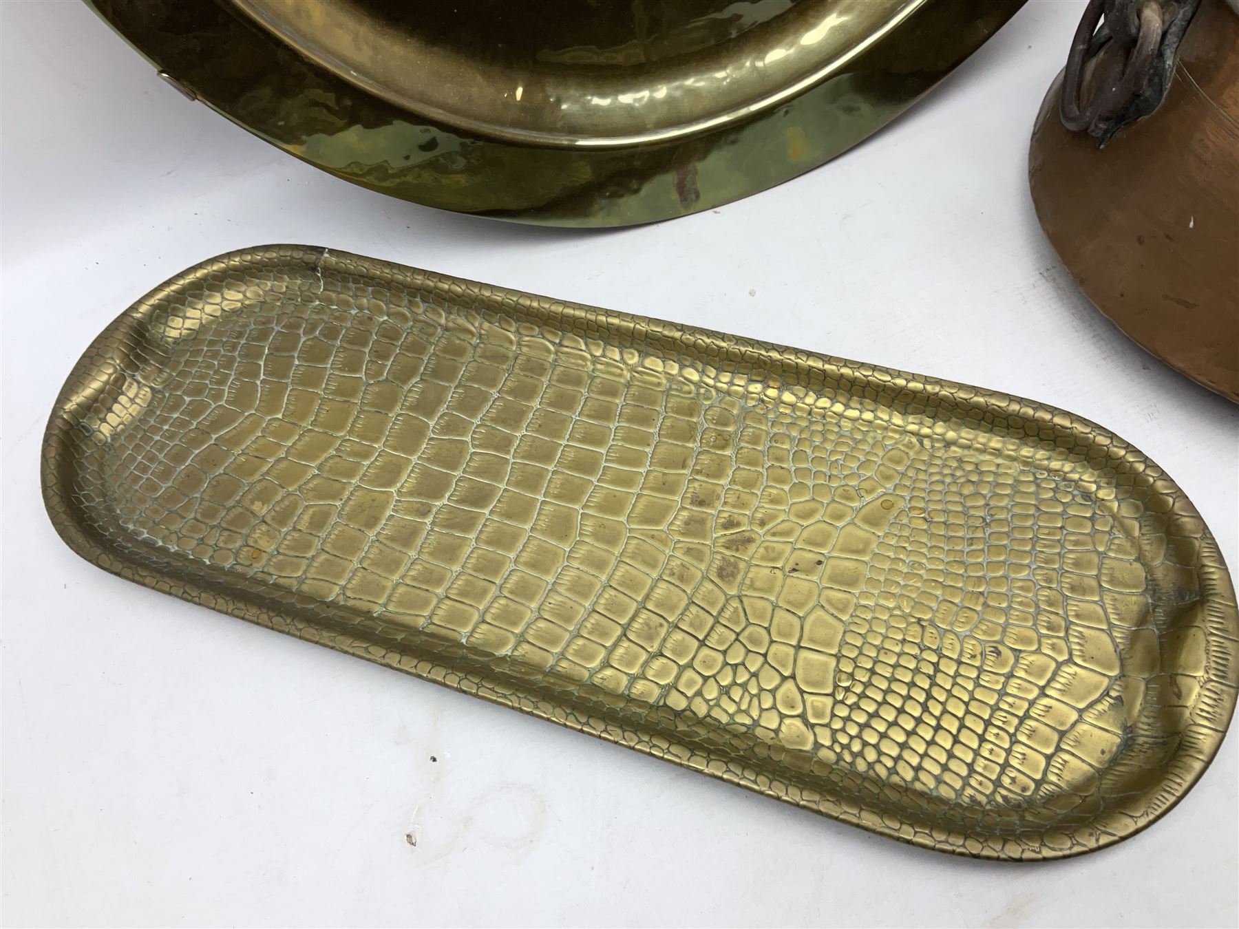 Copper pot with twin iron handles, large heavy planished brass charger and brass crocodile tray, charger D59cm
