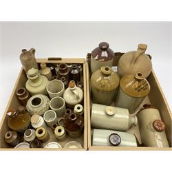 A group of stoneware bottles or various forms, to include flagons, hot water bottles, etc., examples marked Broderick & Peters 38 High Street B136, Hull Brewery Co Ltd Silvester Street Hull 9153. (Qty). 