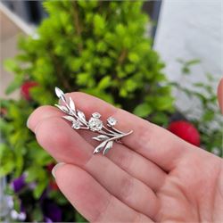 18ct white gold diamond flower brooch, set with a principal old cut diamond of approx 1.00 carat, surrounded by three further old cut diamonds, total diamond weight approx 1.75 carat