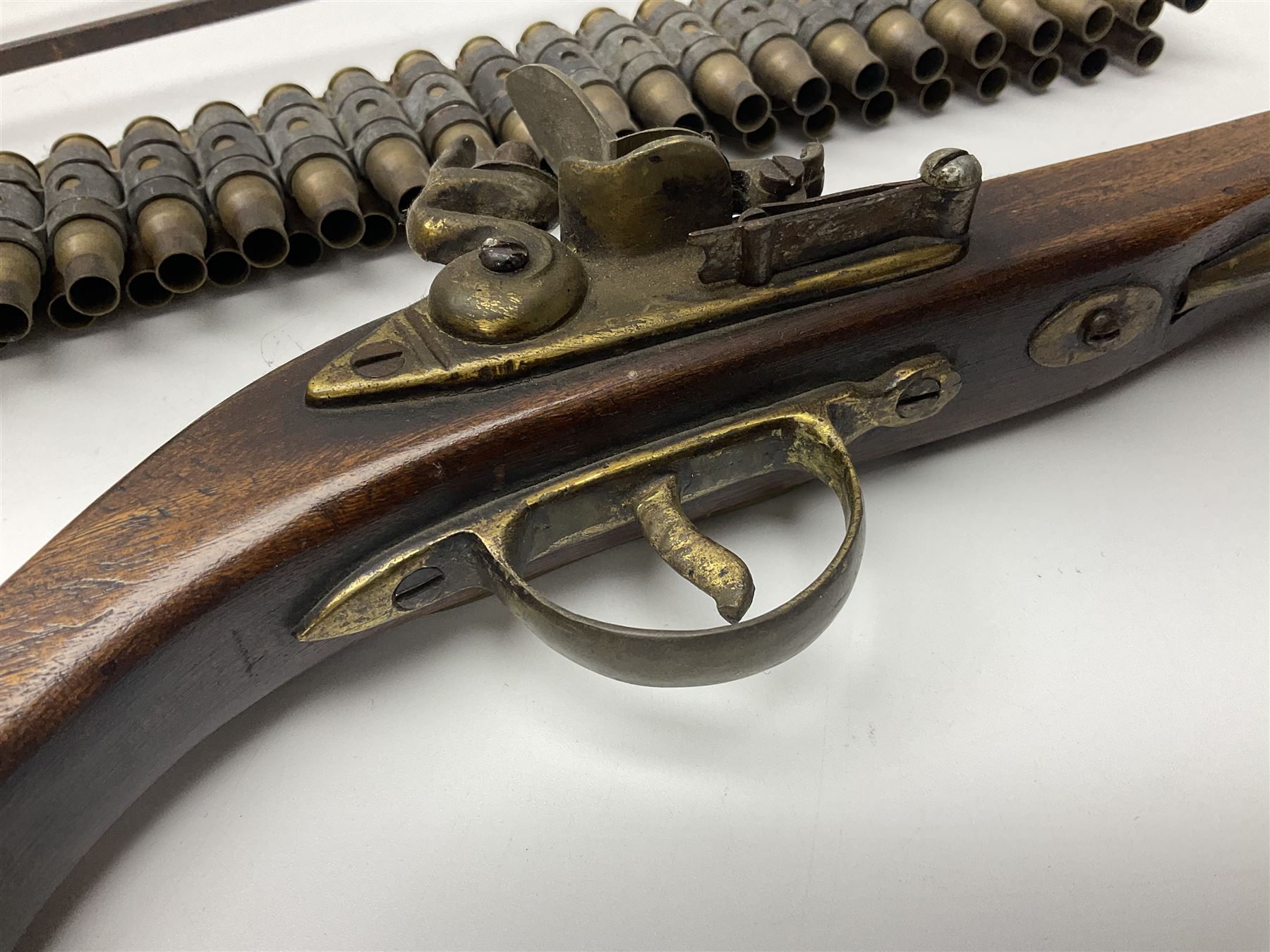 Leather covered swagger/sword stick with 40cm steel blade L62cm overall; another ash sword stick with 30cm diamond section steel blade; pair of fencing foils, the blades marked Solingen; two reproduction flintlock pistols; and 92cm inert cartridge belt (7)