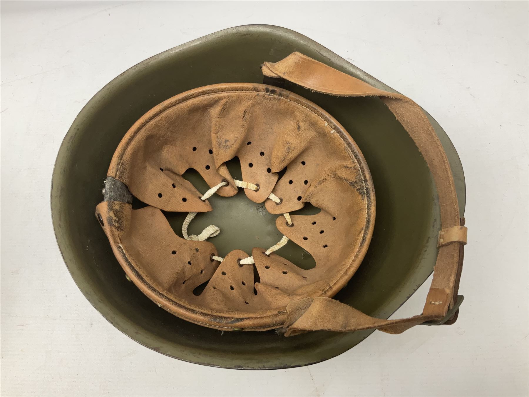 Two 1960s East Block Soviet style helmets - Czechoslovakian and Russian; both with liners (2)