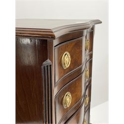 Small 20th century serpentine walnut four drawer chest, shell carved cabriole supports