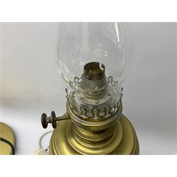 Converted oil lamp, brass table lamp with extendable arm, together with two other lamps, a lampshade and a wall sconce  