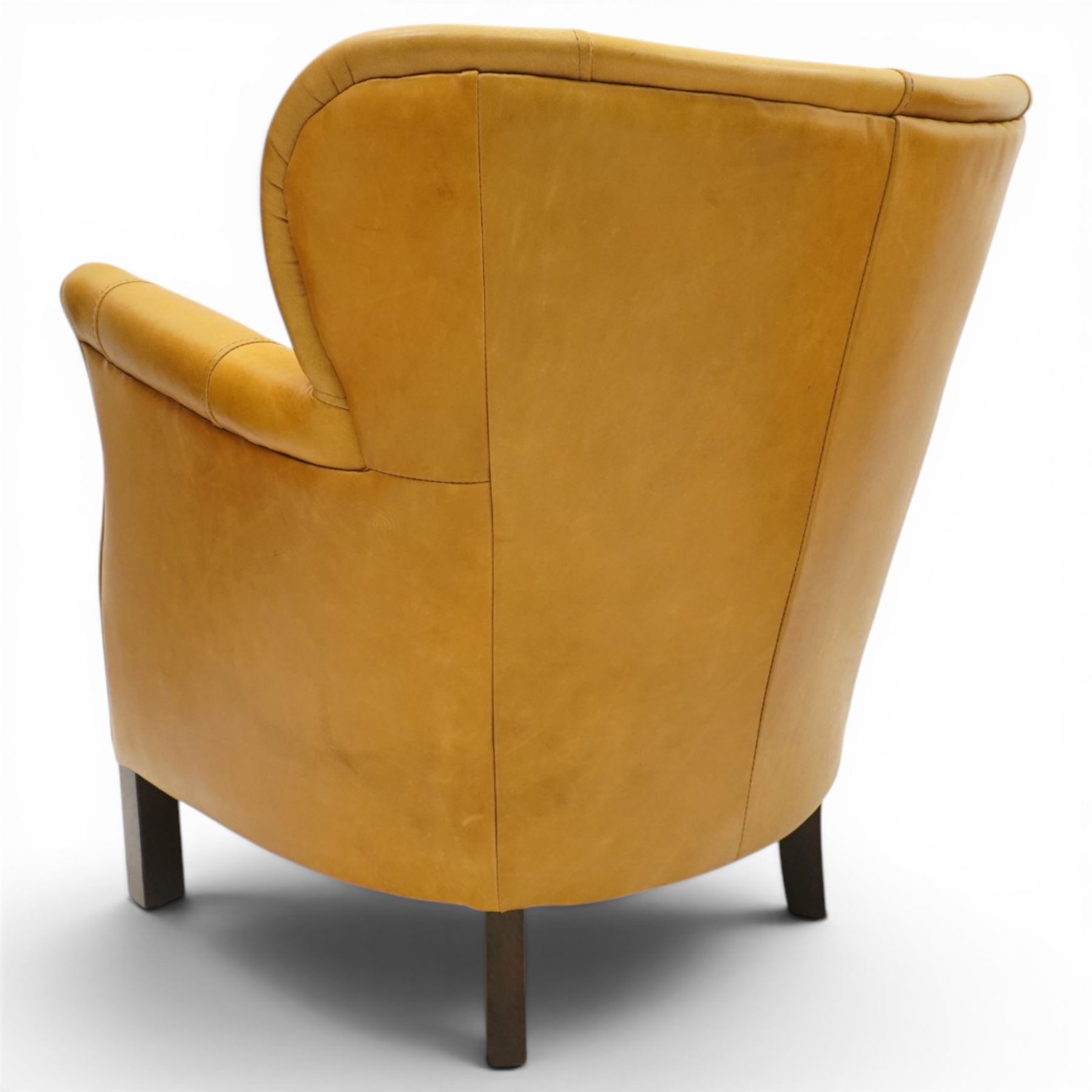John Lewis - Pair of ochre leather tub chairs, downswept arms, button back and arms, raised on dark supports 