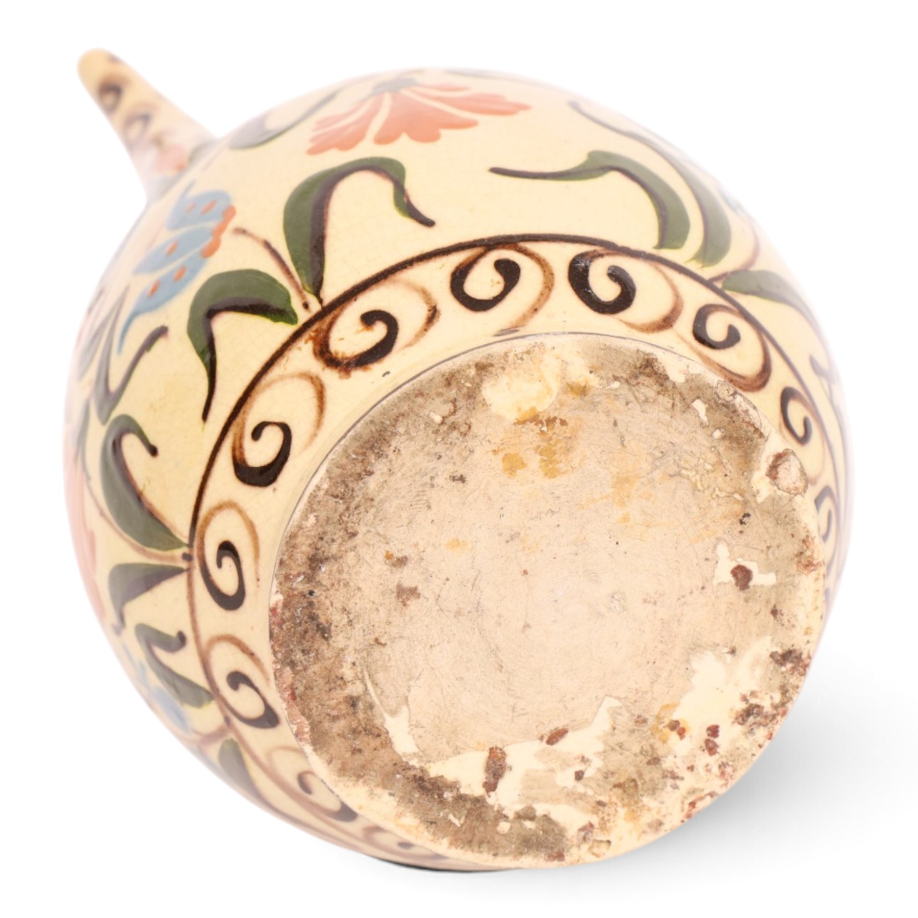 Iznik-style ewer, late 19th/early 20th century, the ovoid body painted with stylized flowers upon a cream ground, the neck with repeating scrolling boarder, H28cm