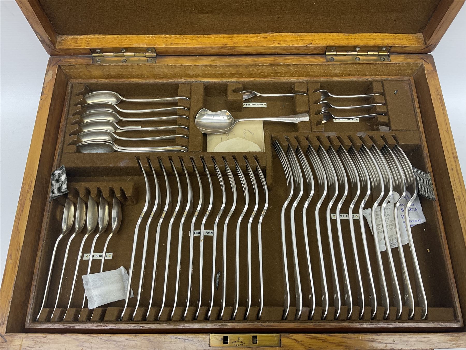 Mappin & Webb silver plated canteen of cutlery, the oak case with hinged lid two two removable trays, and sunken brass handles, H19cm, L52cm