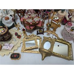 Dolls house living room and ding room furniture, including sofa, chair, long case clock, Christmas trees, fireplace, dresser, chairs, tables, mirrors, seven figures and a collection of predominantly Christmas themed decorations, food, etc