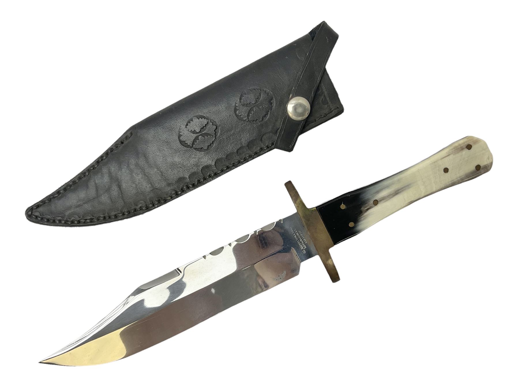 Large Bowie knife the 21cm steel blade marked J.E. Middleton & Sons Rockingham Street Sheffield with brass cross-piece and polished horn grip scales; in leather sheath L36cm overall