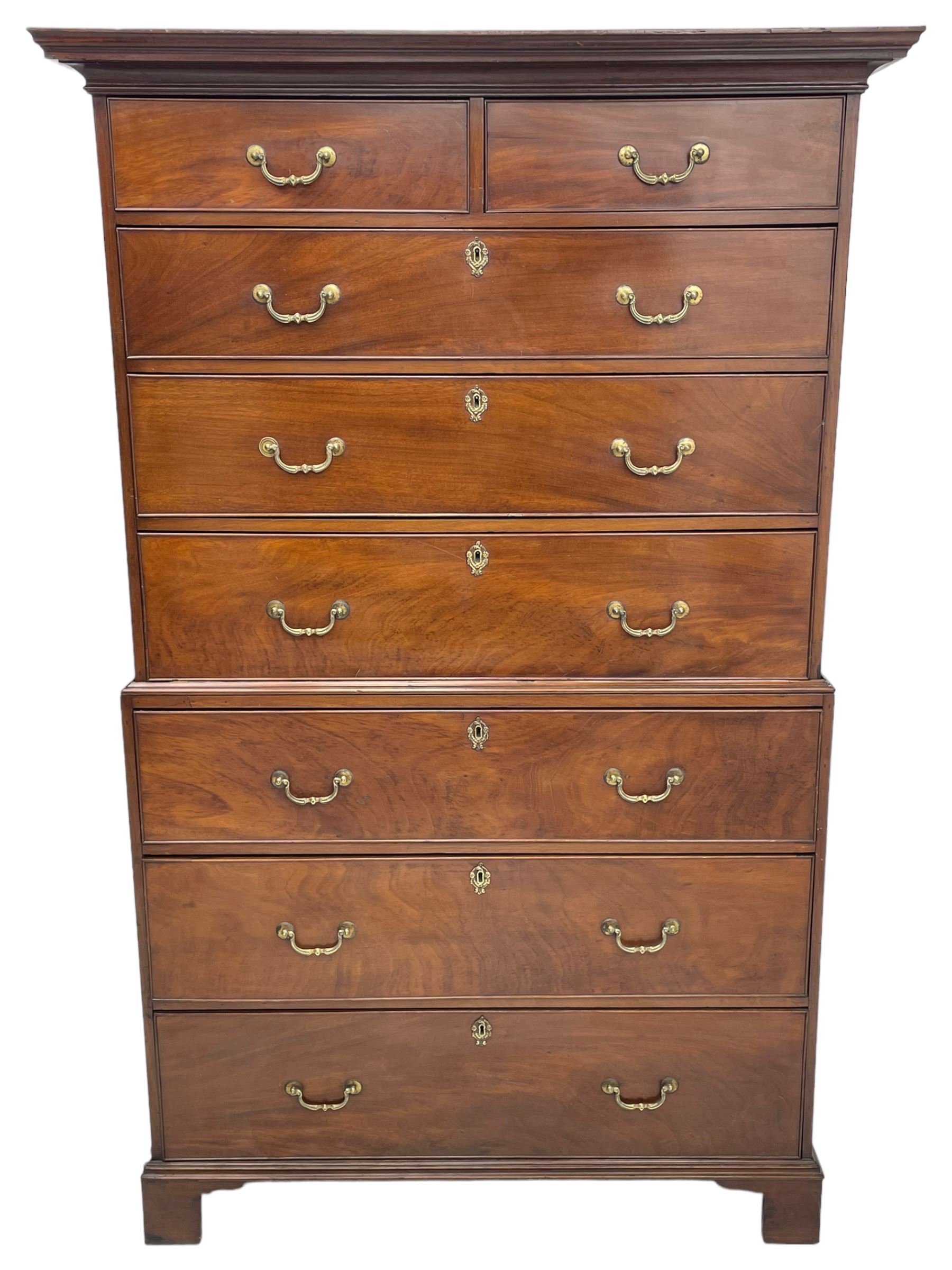 George III figured mahogany chest-on-chest, projecting moulded cornice over two short and six long graduating cock-beaded drawers, on bracket feet