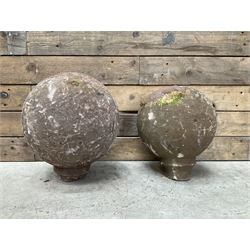Two spherical stone gate post finials