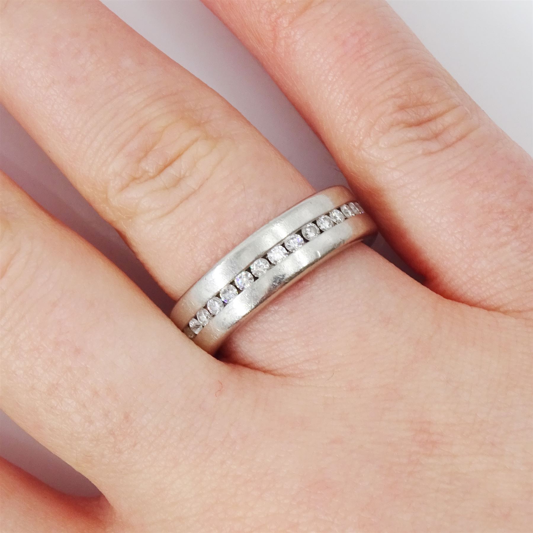 Henrich And Denzel platinum diamond full eternity ring, channel set with thirty-four round brilliant cut diamonds, stamped 950 PT, total diamond weight 0.73 carat