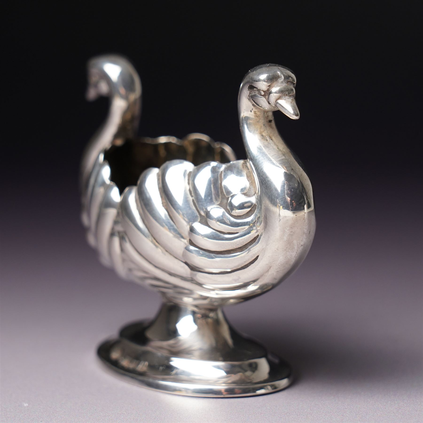 Pair of Victorian silver double headed Swan shape salts L7cm Chester 1897 Maker Florence Warden together with a pair of plated spade shape spoons 