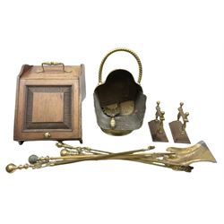 Carved oak coal scuttle, together with a brass coal scuttle with a twisted handle, fire tools and fire dogs