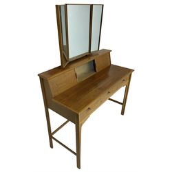 Heals of London - 1950s walnut and beech dressing table, raised triple mirror back over trinket compartments enclosed by sliding doors, above three drawers, on tapering supports