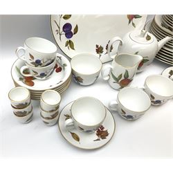 Royal Worcester tea and dinner wears for six, decorated in Evesham pattern,  comprising dinner plates, salad plates, side plates, bowls, tea cups, saucers, egg cups, serving platter, teapot, milk jug and open sugar bowl. 