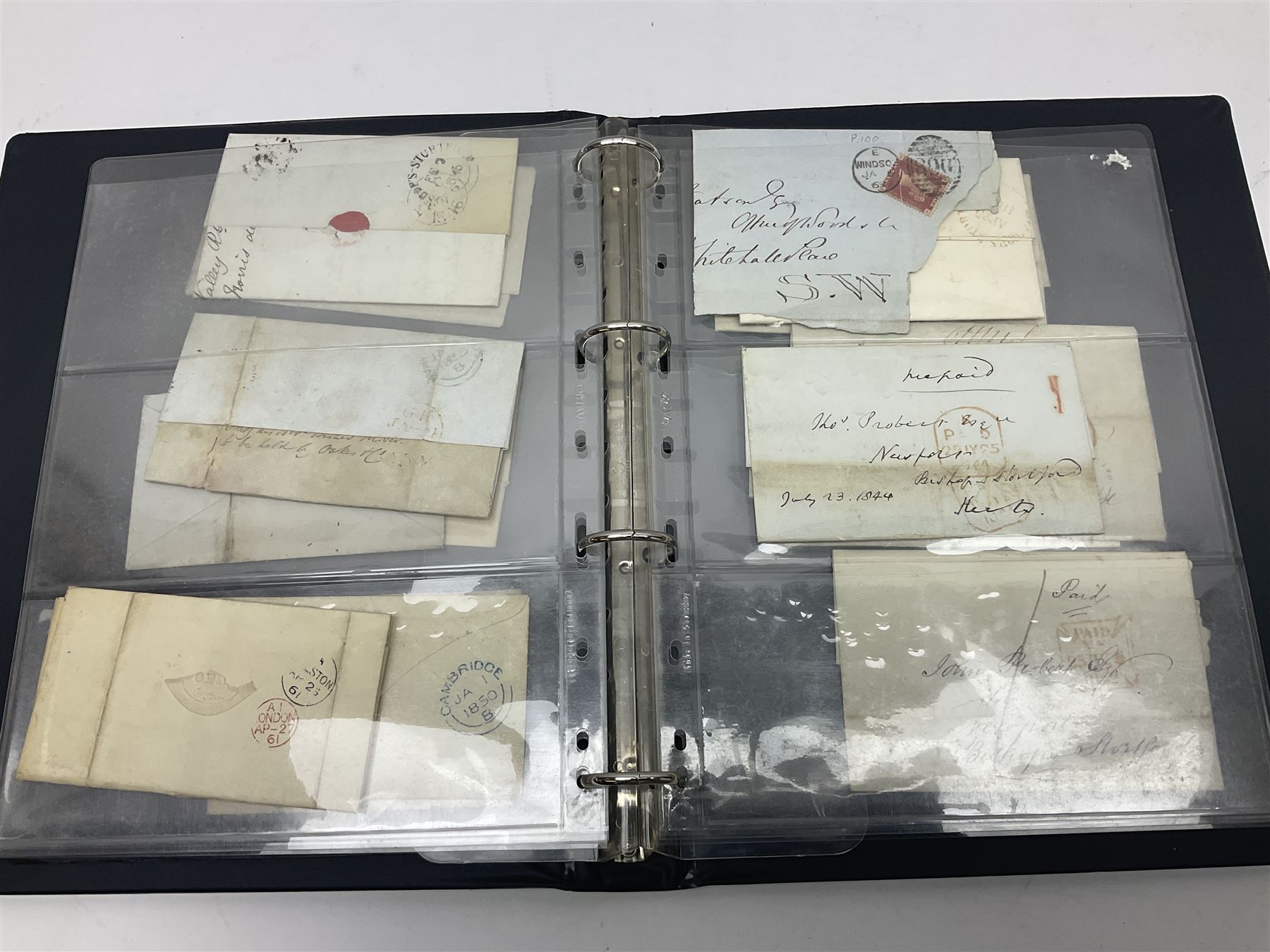 Postal history, including pre-stamp, Queen Victoria imperf penny reds on covers or entires a few with black MX cancels, 1841 two pence blue with white lines added on mourning cover, perf penny red on cover etc, housed in a ring binder folder