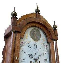 William Gostling of Diss  (Norfolk)-  Late 18th century 8-day oak longcase clock c1780-90, break arch top with scalloped cresting and three brass finials, glazed break arch hood door flanked by turned pilasters with brass capitals, trunk with a long trunk door and rounded top on a square plinth with an applied and shaped skirting, early painted Wilson of Birmingham dial with Roman numerals and five minute Arabic's, matching steel hands and second pointer, arched square ended calendar aperture with date disc behind, floral spandrels within gesso borders and a painted rocking automaton representing Mercury to the break arch, dial pinned via a false plate to a weight driven rack striking movement with a recoil anchor escapement, striking the hours on a cast bell. With pendulum weights and key. 
William Gostling (II) is recorded as working in Diss from 1774 to 1797, succeeded by widow Anne and son George . The dial of this clock is illustrated and discussed in detail in M.F. Tennants book 
