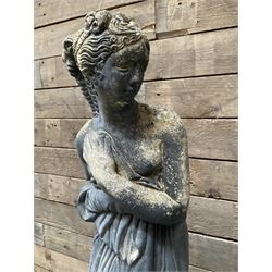 Cast stone weathered garden statue of Venus on pedestal