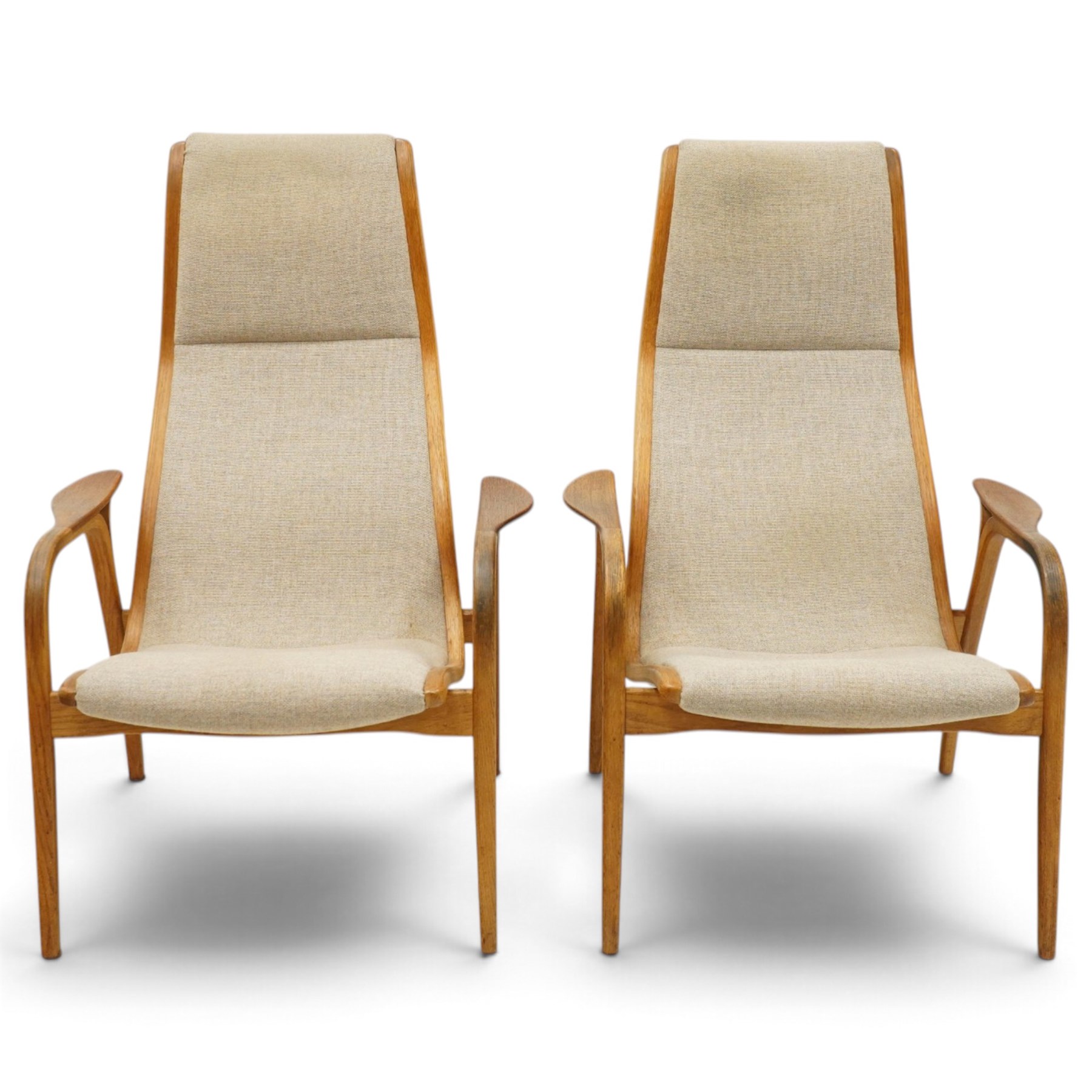 Yngve Ekström (1913-1988) for Swedese - pair of 'Lamino' bent-oak framed easy armchairs, the high reclined back over shaped swept arms and splayed supports, upholstered in beige fabric
