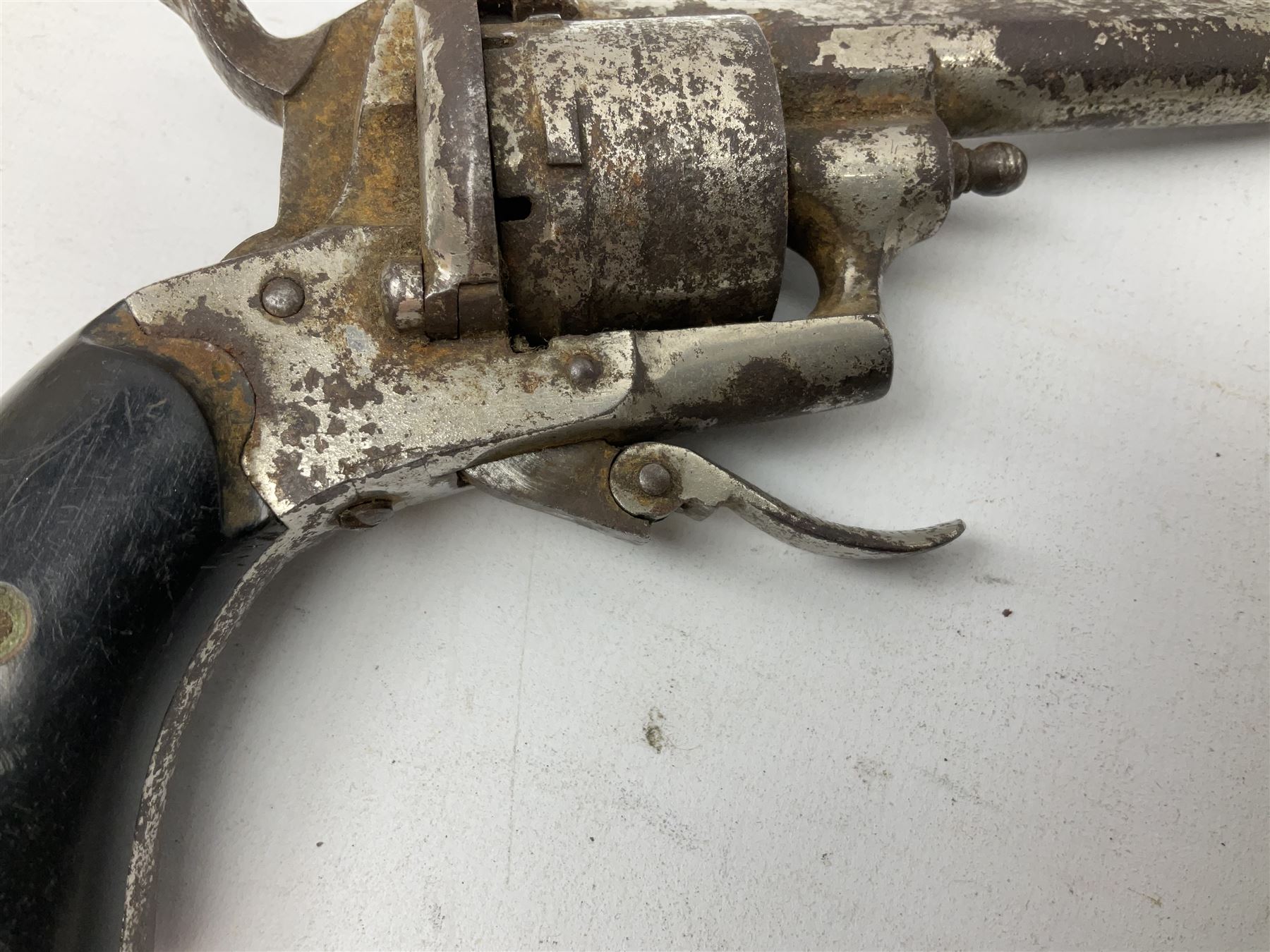 19th century 7mm six-shot pin-fire revolver, with folding trigger, two-piece ebonised grip and ejector rod in butt L17cm