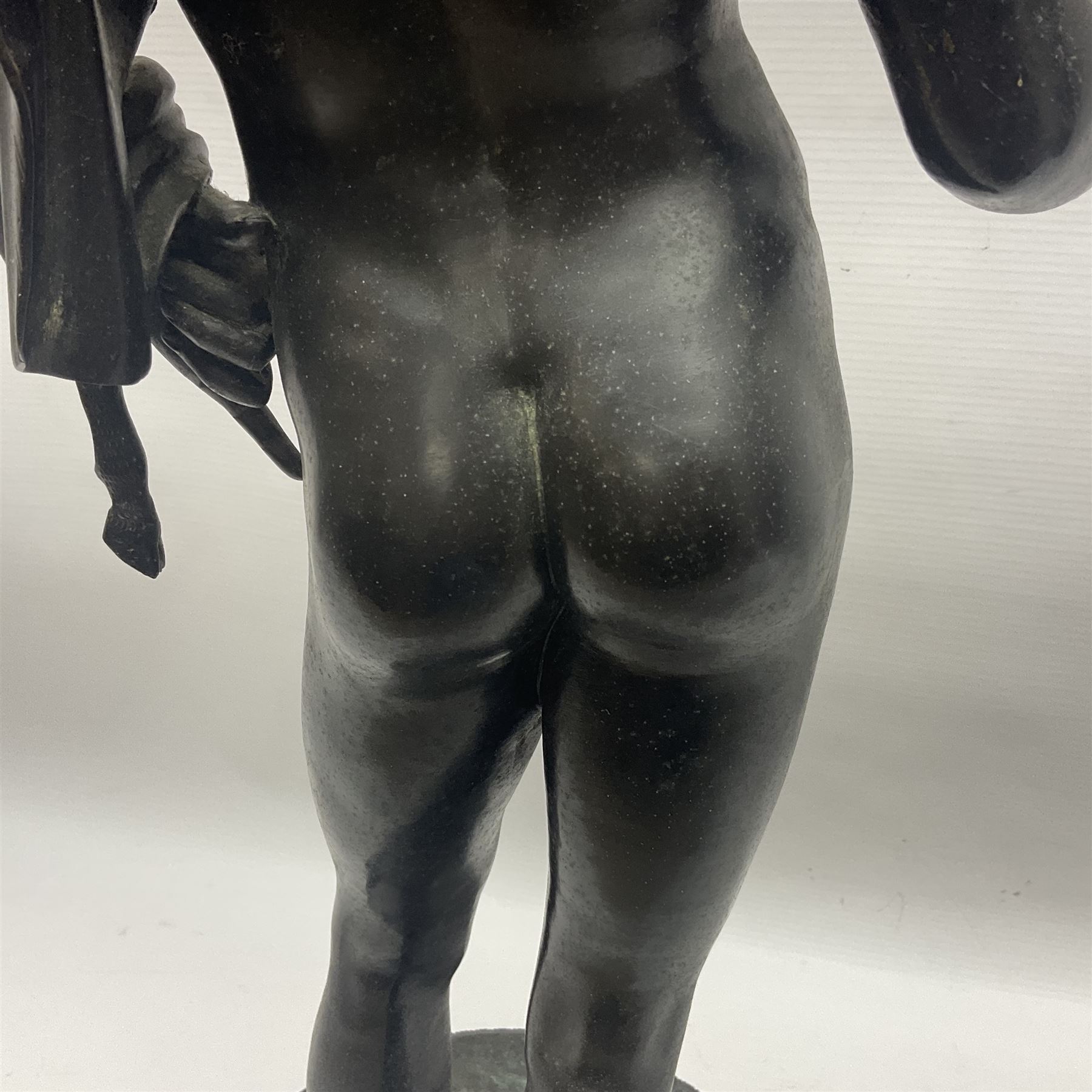 Bronzed classical nude male figure, upon a stepped circular base, H61cm 