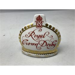 Four Royal Crown Derby teddy paperweights, comprising Teddy Cook, two Teddy George and Seated Teddy, all without stoppers, together with Crown Namestake with gold stopper 
