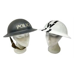 WW2 Home Front 'Police' black painted steel helmet with original liner and webbing chin strap, impressed R.O. Co. 1/1939; and re-painted shell only for WW2 Wardens steel helmet impressed AMC II 1941 C676 (2)