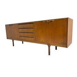 Tom Robertson for AH McIntosh & Co of Kirkaldy - mid-20th century teak sideboard, fitted with four central drawers, flanked by cupboard enclosing shelves and sliding tray, raised on cylindrical supports