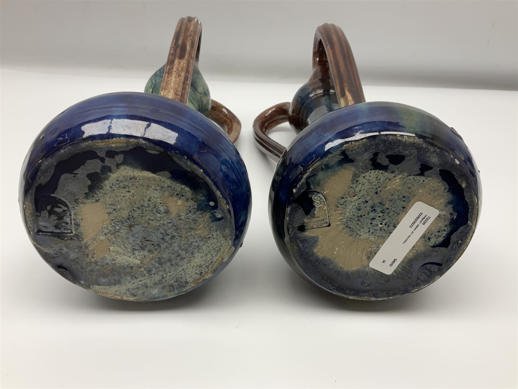 Pair of Art Nouveau style vases, probably Belgian, each with merging blue, brown and green decoration and three handles, impressed LSV beneath, H32cm