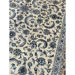 Persian Nain pale sage ground carpet, decorated with curled leaf motifs and palmettes, the busy borders decorated densely with similar design, within floral pattern guard stripes 