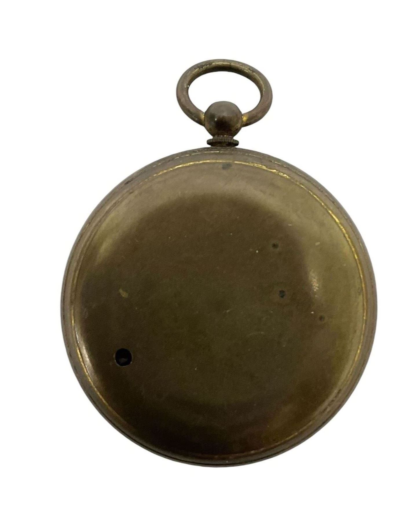 Edwardian pocket aneroid barometer in a brass case. Compensated.