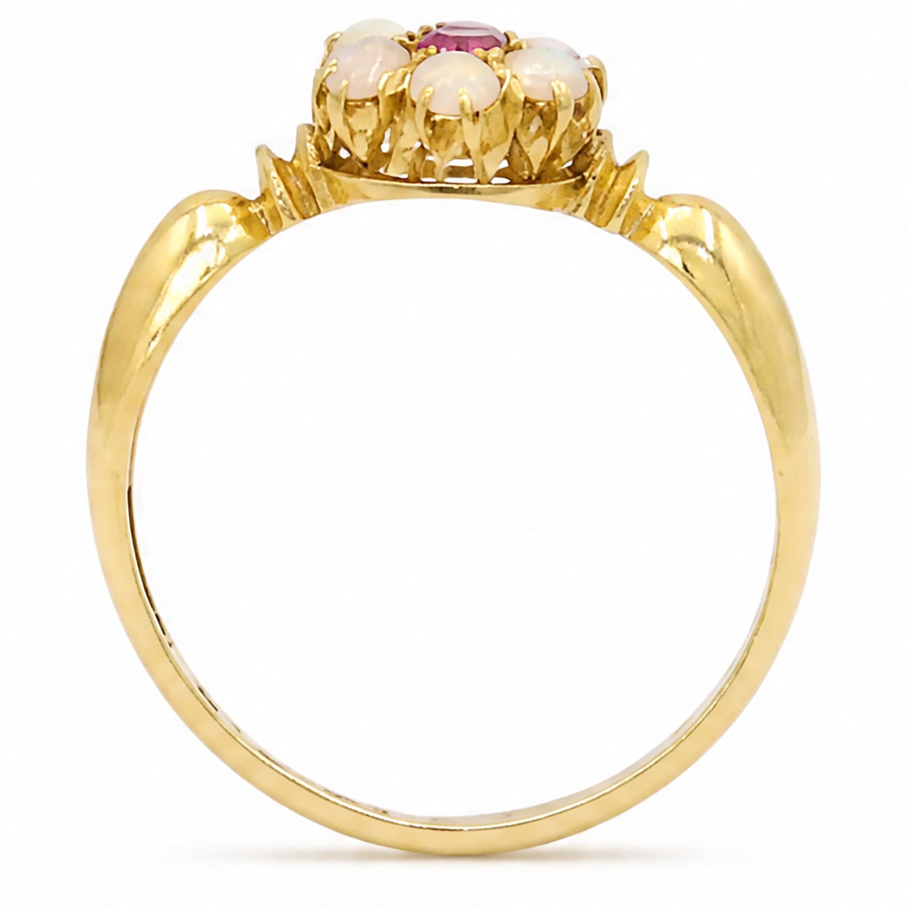 Edwardian 18ct gold ruby and opal flower head cluster ring, single oval cut ruby, surrounded by six round cut opals, Birmingham 1902, boxed