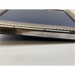 Set of six 1960's silver coffee spoons, hallmarked Sheffield, contained within a fitted case with interior inscribed Harrods, together with a silver napkin ring, hallmarked Birmingham, and a silver plated photograph frame, approximate silver weight 68.4 grams