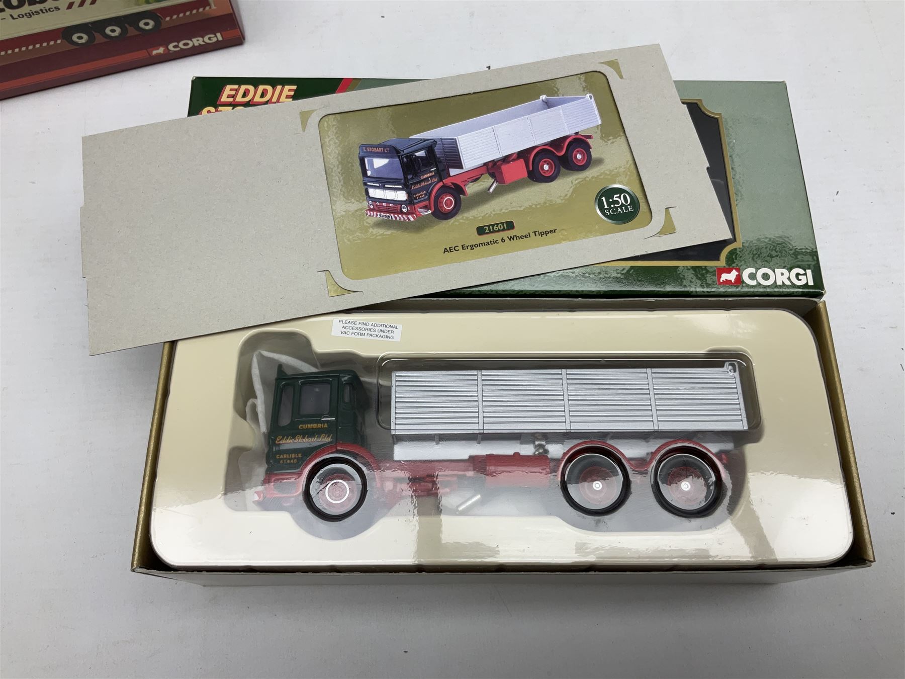 Corgi Eddie Stobart - four Classics lorries; 18801 Bedford KM, 97369 AEC Truck & Trailer, 23101 Ford Transcontinental Tilt Trailer and 14303 Foden S21 Artic Trailer; limited edition 21601 AEC Ergomatic 6-wheel Tipper; and two others in the Roadscene and Truckfest 25 Series; all boxed (7)