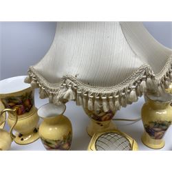 Collection of Aynsley Orchard Gold pattern wares, comprising lamp base, three jars and covers, six vases or various size and form, large jug, lidded dish, pair of cruets, pair of candlesticks, mug, two pin dishes, lobed dish, tea cup, saucer, size plate, and cake plate, and two further cups and saucers, each cup decorated with central Orchard Gold reserve to the interior against a mottled pink or green ground. 