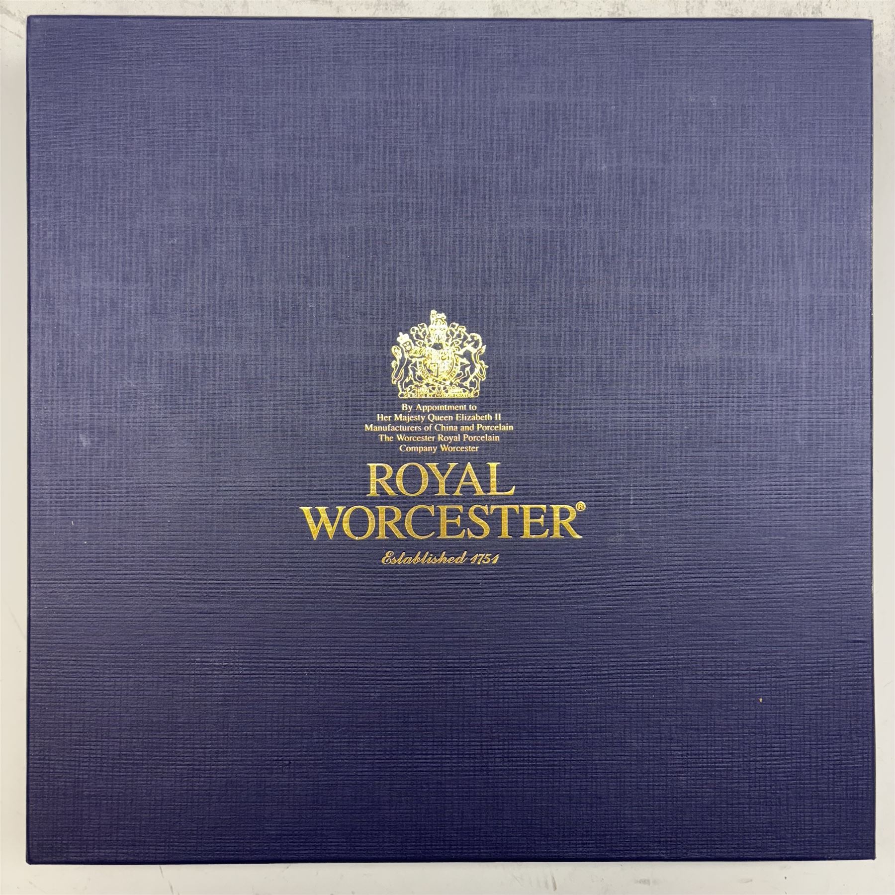 Late 20th century Royal Worcester star plate, of circular form with shaped with gilt shaped rim, hand painted by E Clark with still life of fruit upon mossy ground, signed E Clarke, with marks beneath including limited edition no 28/100, with makers fitted card box, D23cm
