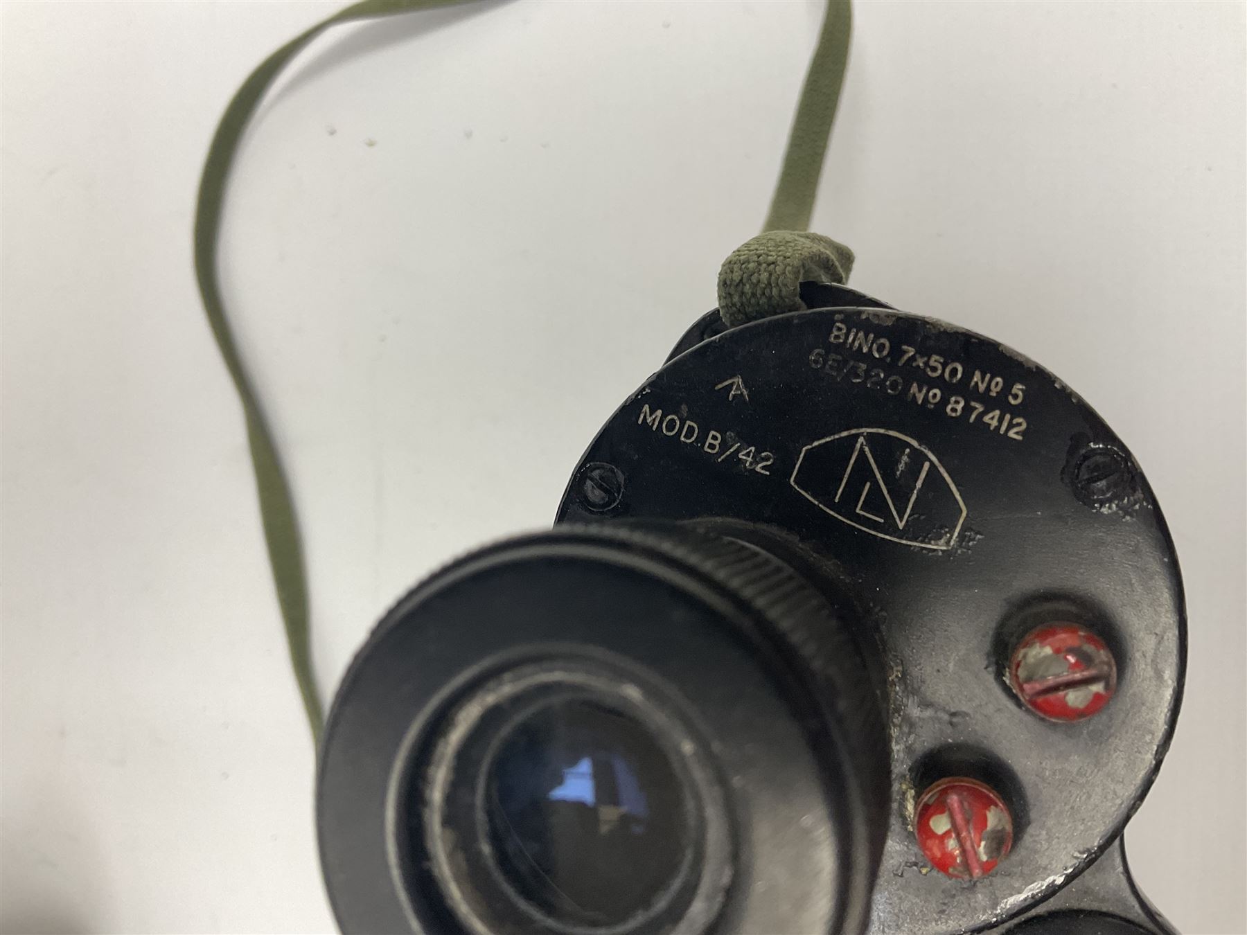 Pair of British World War Two issue black-painted binoculars, Bino 7x50 No. 5, 6E/320, No. 87412, MoD.B/42, with case, together with Nipole 10 x 50 binoculars and two other pairs