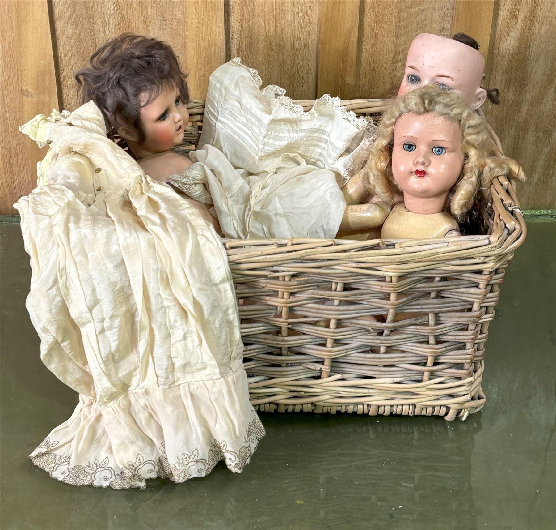 19th century bisque head doll, two other articulated dolls, together with a quantity of Victorian dolls clothes.  - COLLECTION BY APPOINTMENT FROM: The White House, Thirsk Road, Easingwold, York, YO61 3NF - CALL 01723 507111 TO ARRANGE