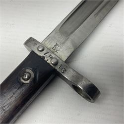 Austrian Model 1895 Carbine knife bayonet with 24.5cm fullered steel blade; various marks to the ricasso including F.G. GY.; cross-piece marked No.7843; in steel scabbard L37cm overall