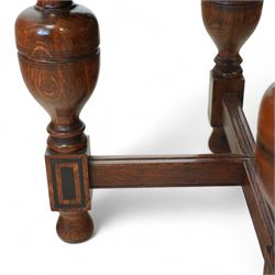 Late Victorian oak centre table, octagonal moulded top over a carved Gothic arched frieze, raised on quadruple baluster turned supports united by X-stretcher with ebonised detailing