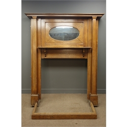  Arts & Craft period oak fire surround, projecting cornice, inset oval mirror, above shelf, square columns pilasters, and fender, W153cm, H181cm, D24cm  