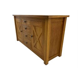 Solid oak sideboard, fitted with four drawers and two cupboards