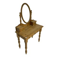 Traditional pine dressing table, oval mirror over two trinket drawers, rectangular top fitted with two drawers, raised on turned supports