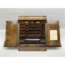 Victorian walnut correspondence box, the sides painted to produce a figured effect, the burr front with twin sloped doors opening to reveal a compartmented interior fitted with pen tray, inkwell recesses, letter rack and removable perpetual calendar, above a hidden lower drawer opened via spring action button to interior, H32.5cm W33.5cm D26cm