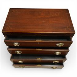 19th century Regency Revival inlaid mahogany chest, the plain rectangular top and frieze inlaid with geometric satinwood stringing, fitted with graduating long drawers fitted with pressed brass patera form handle-plates, on splayed feet with shaped apron