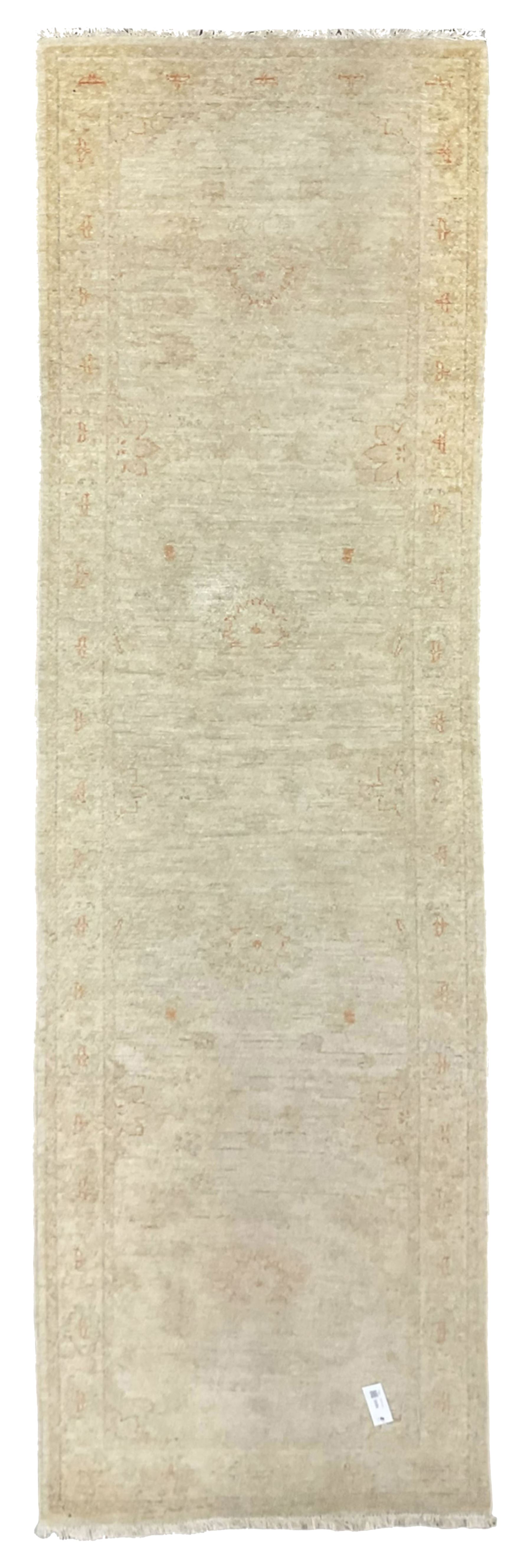 Persian Zeigler runner, ivory ground decorated with faint floral design 