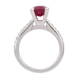 18ct white gold ruby and diamond ring, single oval cut ruby of approx 2.75 carat, with channel set diamond shoulders, hallmarked
