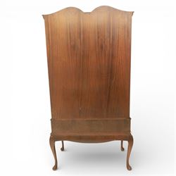 Queen Anne design walnut display cabinet, carved cartouche above two glazed doors enclosing two fixed glass shelves, over two frieze drawers above a heavily carved apron with cabriole supports