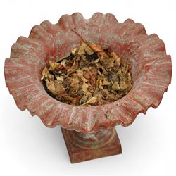 Pair of cast iron garden urns, each of flared form with crinkled edge rims and circular bodies, finished in aged red paint and raised on square bases