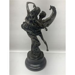 Bronze modeled as entwined dancers, upon a stepped circular base, H29cm